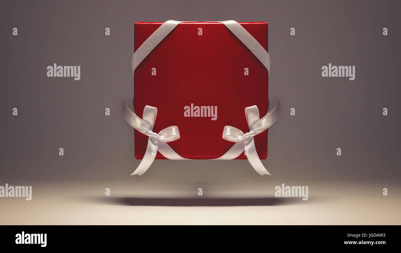 Rotes Feld, verziert mit weißen Bändern auf grauem Hintergrund. Stockfoto