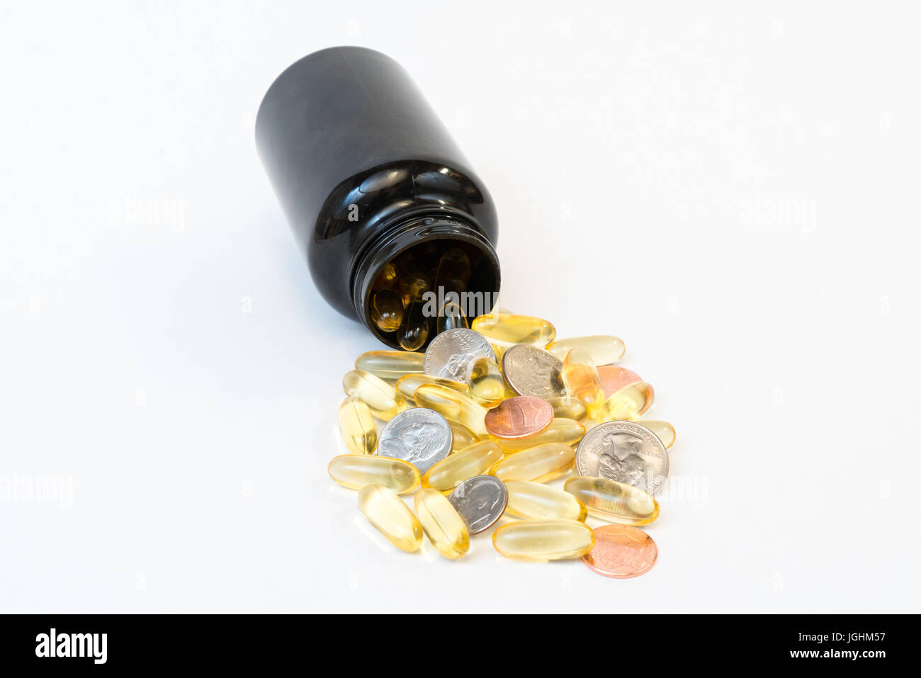Teure Vitamine und Pillen mit Medizinfläschchen und Geld Stockfoto