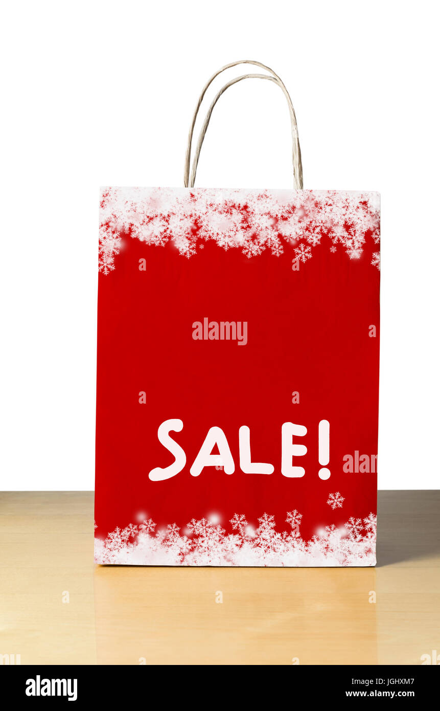 Winter oder Weihnachten Verkauf Einkaufstasche in rot mit weißen Schneeflocke grenzt an oben und unten und das Wort "SALE!" in der unteren Hälfte mit Textfreiraum Stockfoto