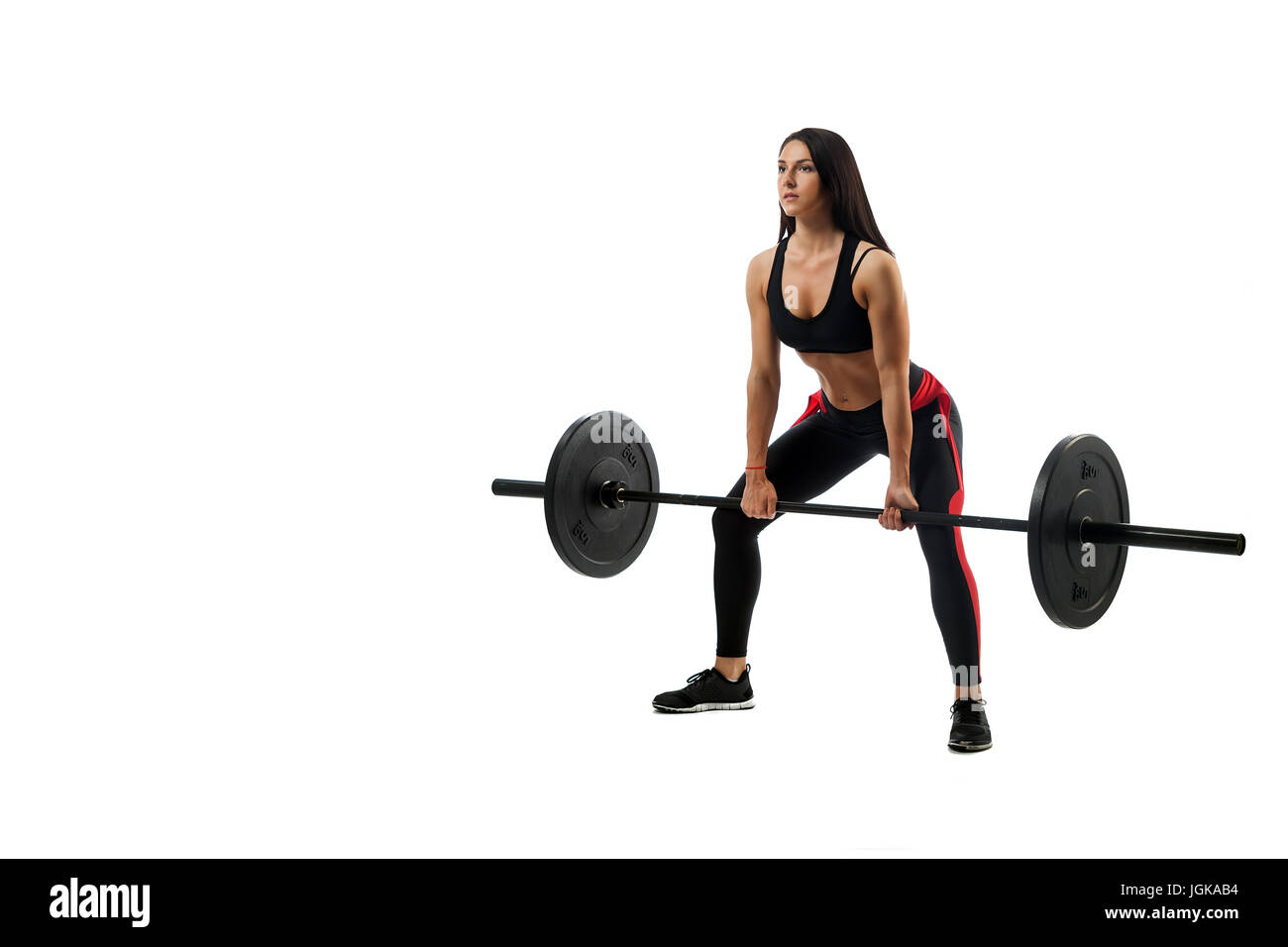 Junge athletische Frau deadlift Begierde mit einer Langhantel auf weißem Hintergrund isoliert, Position der ein Mischling Stockfoto