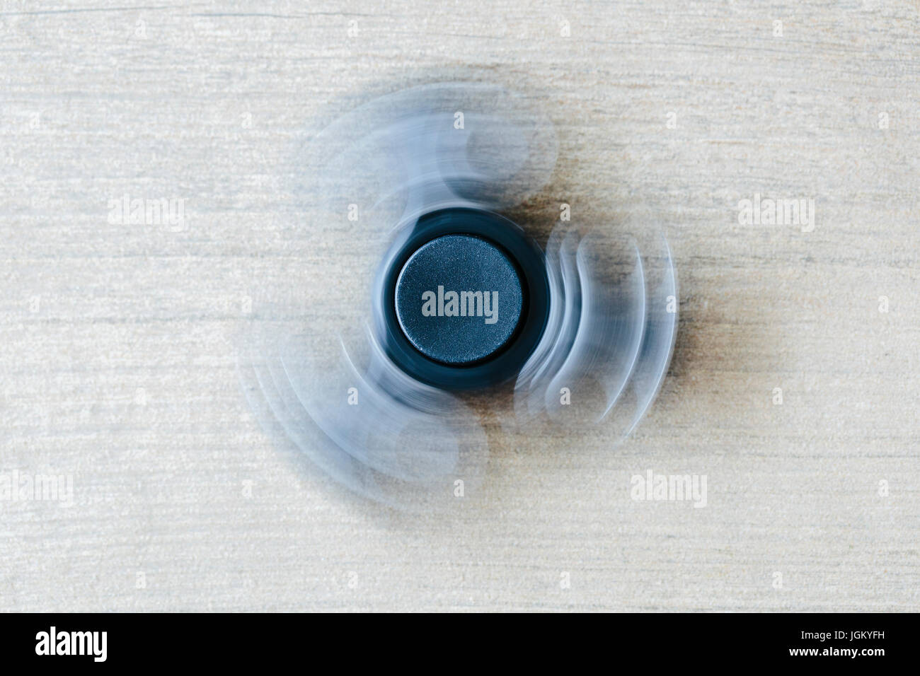 Nahaufnahme einer Spinnerei Fidget Spinner mit Motion blur Stockfoto