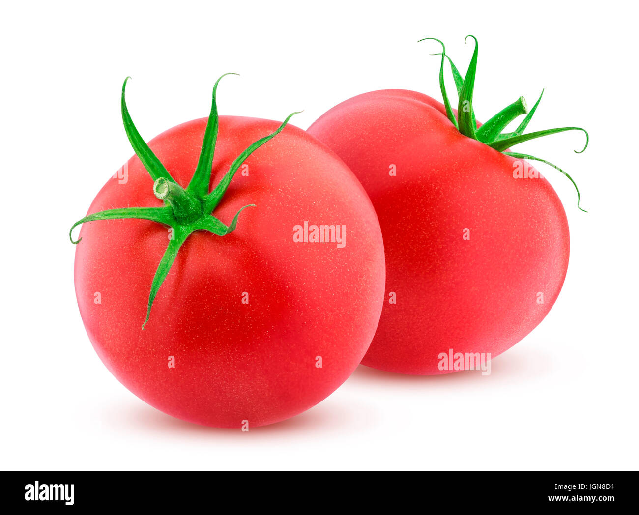 Zwei ganze Tomaten isoliert auf weißem Hintergrund Stockfoto