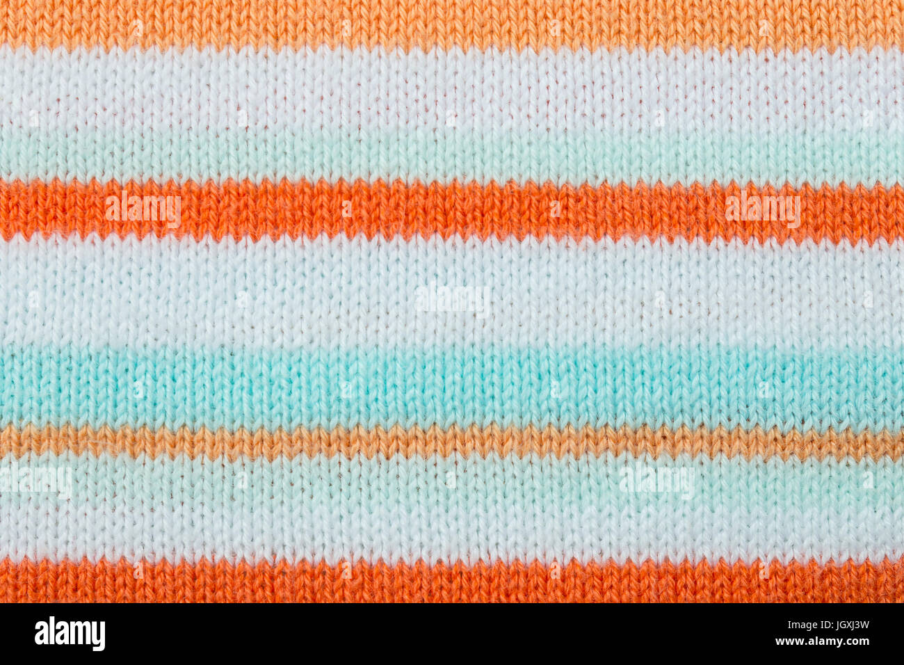 Orange Stoff Textilhintergrund oder Hintergrund, Strickmuster stricken. Stricken oder gestrickten Hintergrund für Design. Streifen-Line-stricken-Hintergrund. k Stockfoto