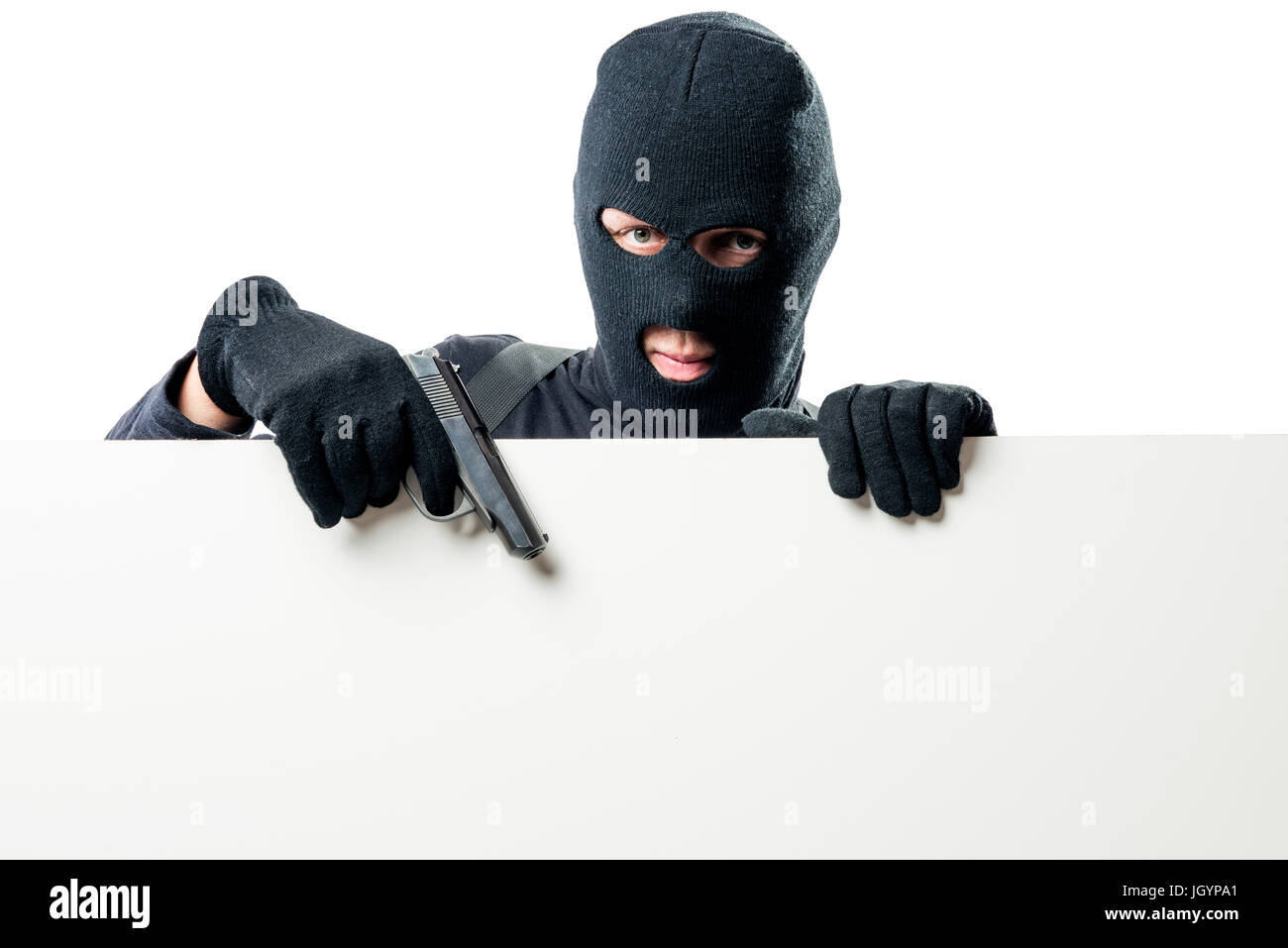 Bewaffnete Terroristen zeigt ein Plakat mit einer Pistole Stockfoto