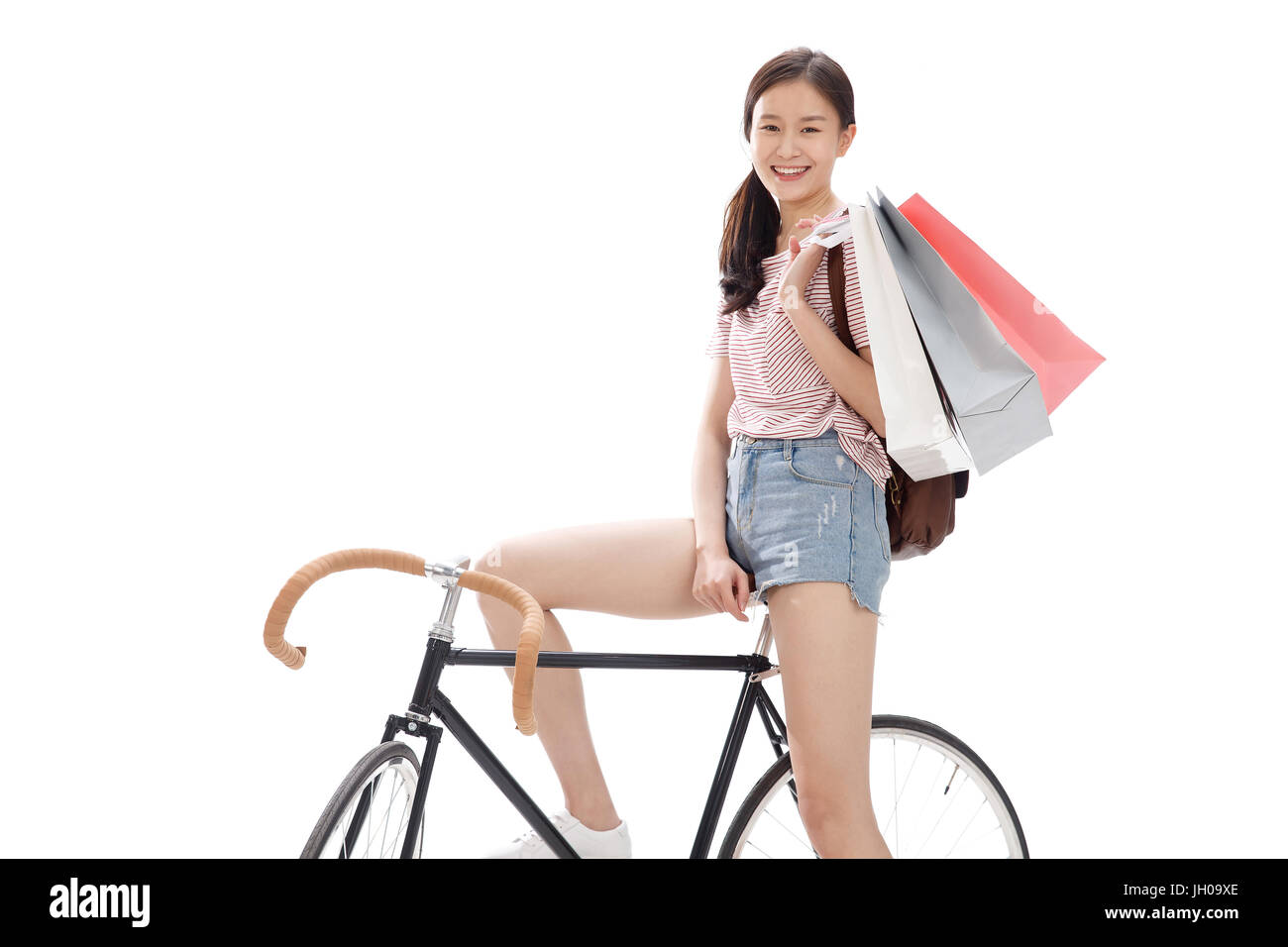 Junge Frau Reiten Fahrrad Stockfoto
