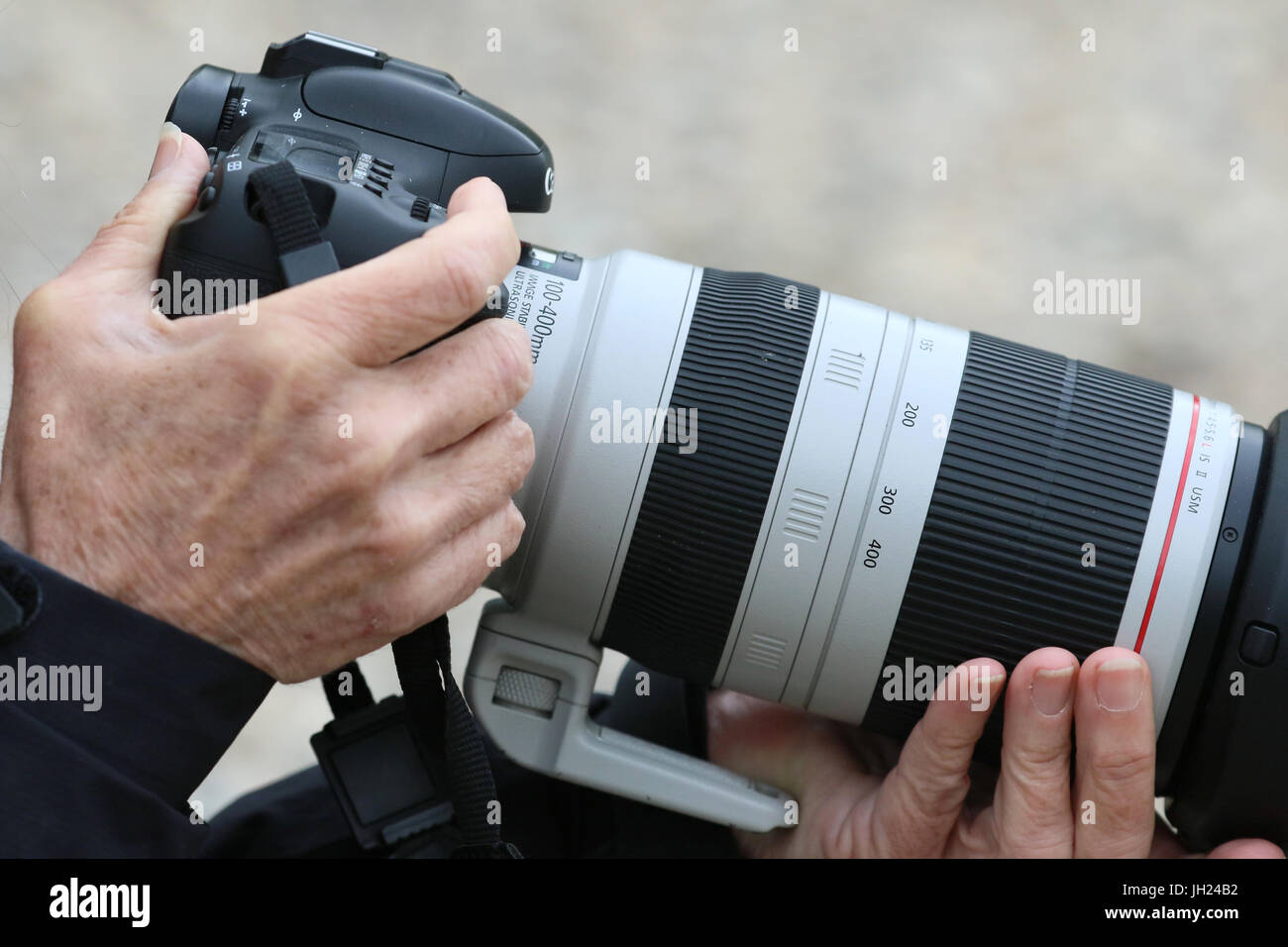 Fotografen und seiner digitalen Kamera. Stockfoto