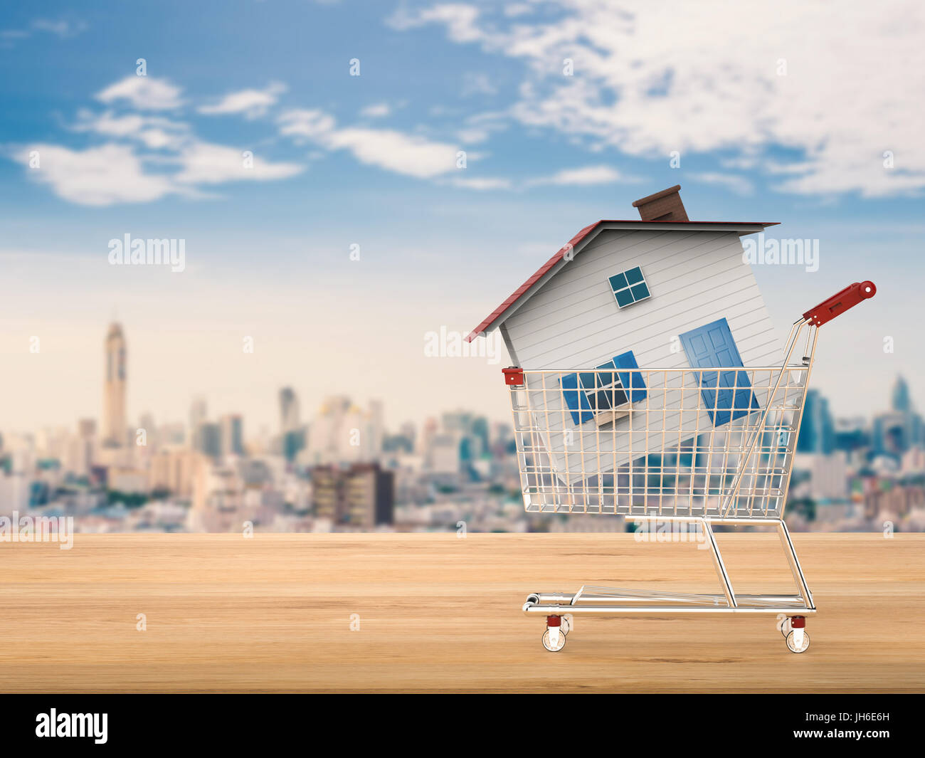 Käufer von Eigenheimen Konzept mit Mock-up Haus im Warenkorb Stockfoto