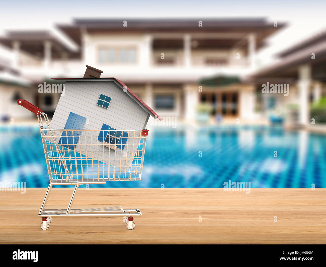Käufer von Eigenheimen Konzept mit Mock-up Haus im Warenkorb Stockfoto