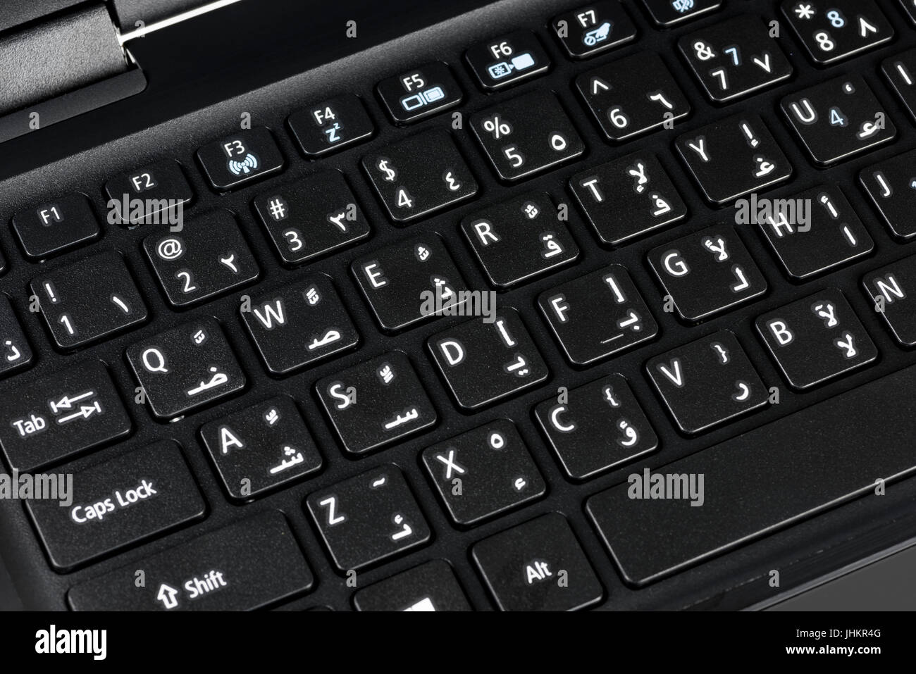 Nahaufnahme einer QWERTY-Tastatur Englisch und Arabisch mit Buchstaben,  Zahlen und Symbole Stockfotografie - Alamy