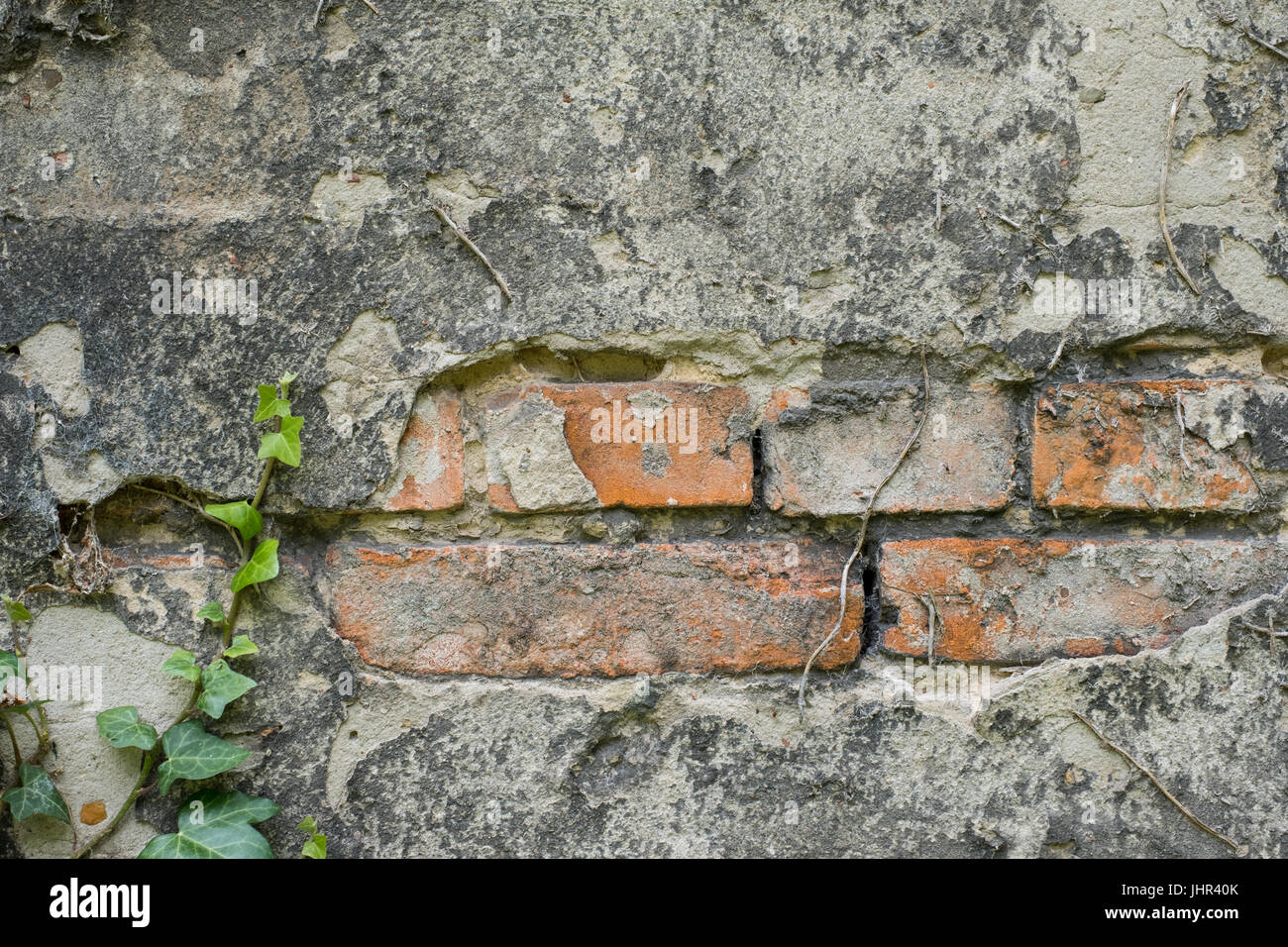 Ziegelsteine hinter peeling Putz, alte Wand closeup Stockfoto Ziegelsteine hinter peeling Putz, alte Wand closeup Stockfoto