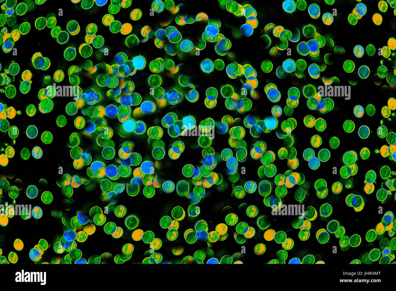 Bokeh-Abstraktion: Ein Schwarm von grün-blau Racing Atome im ganzen Universum Stockfoto