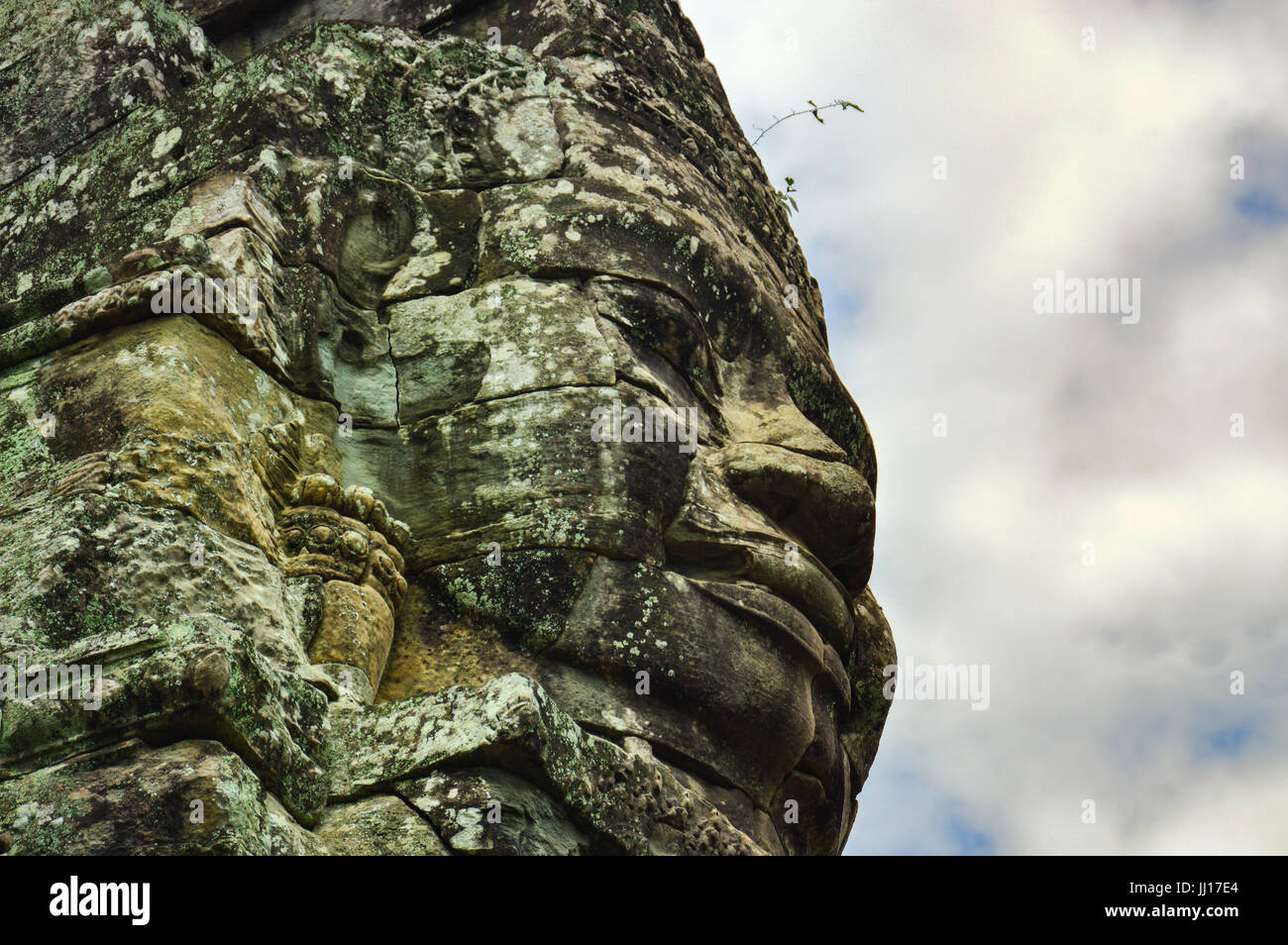 Geschnitzte Gesichter auf Felsen. Bayon Tempel Stockfoto