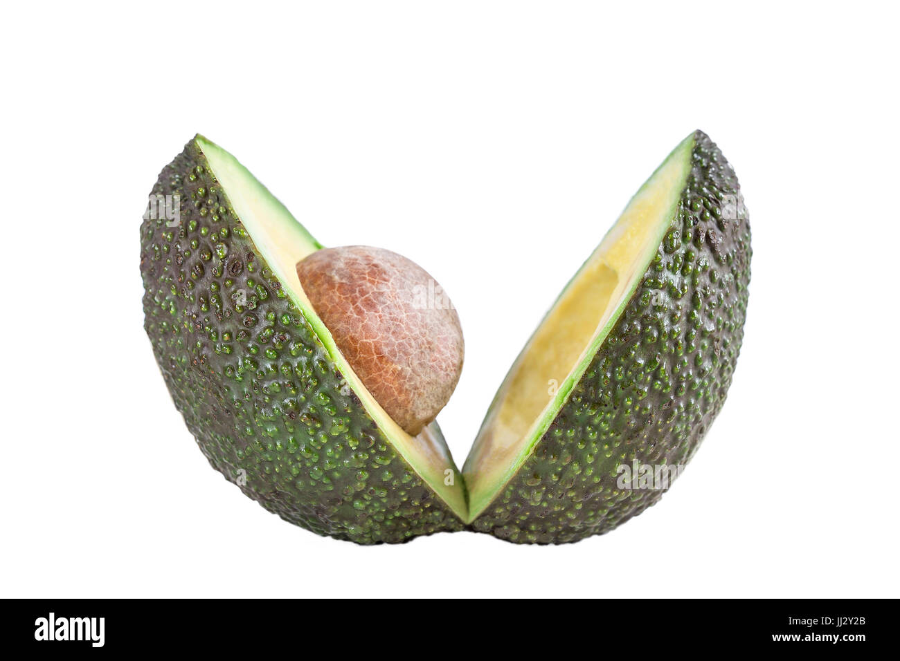 Zwei Scheiben Avocado isolierten Schnitt im V-Profil anzeigen mit Kern Stockfoto