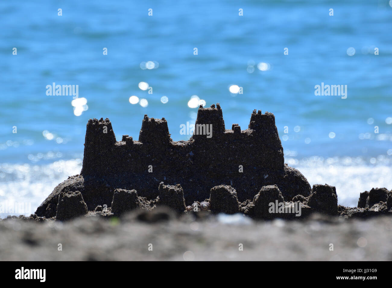 Sandburg am Strand Stockfoto