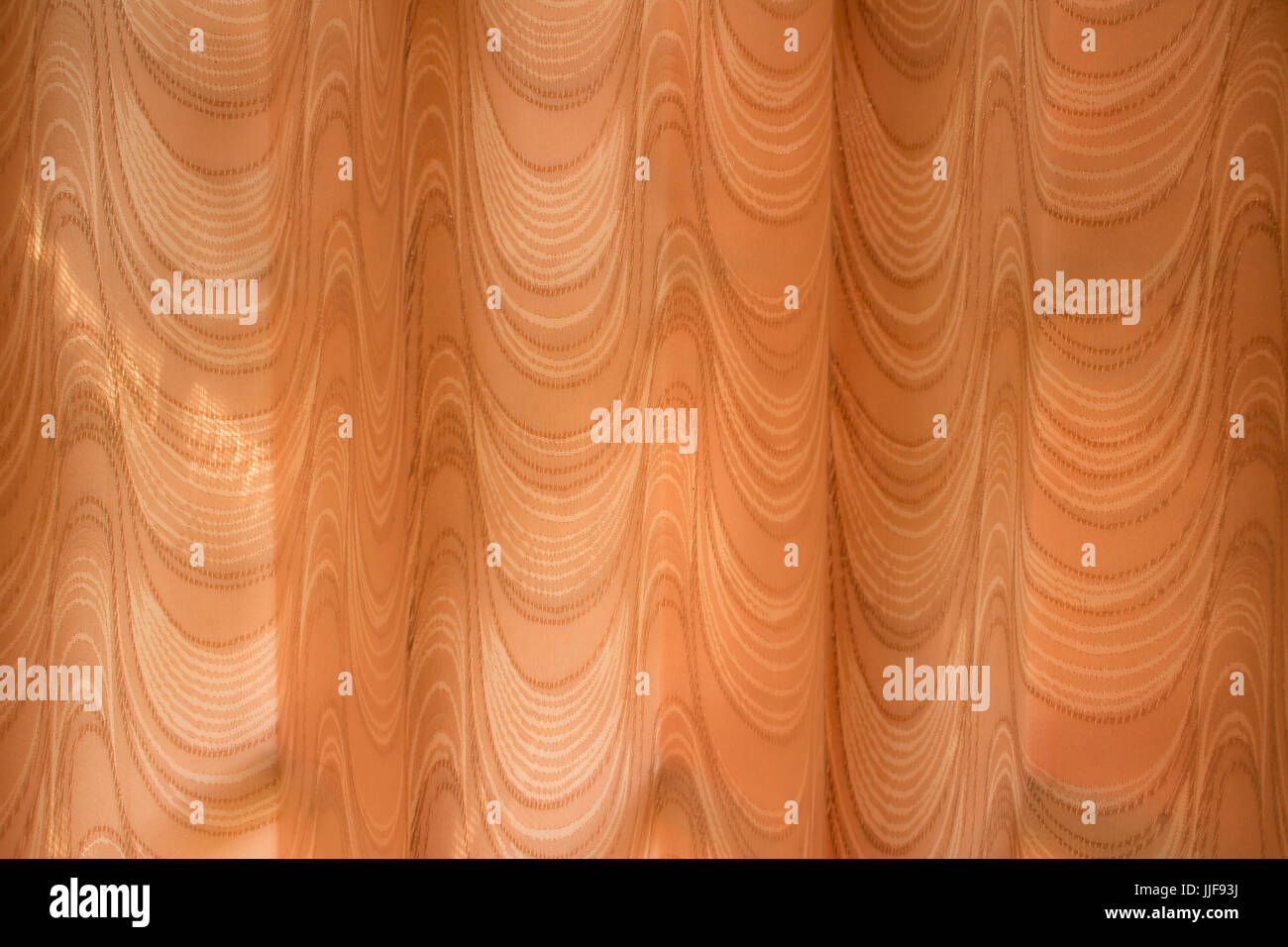 Orange abstrakte Vorhang Textur Hintergrund (Wellenmuster) Stockfoto
