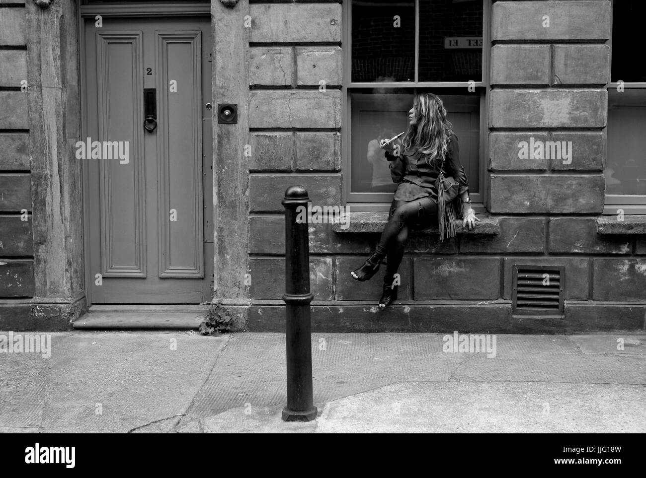 Dampfen Mädchen, Princelet Street, Spitalfields, London. Stockfoto