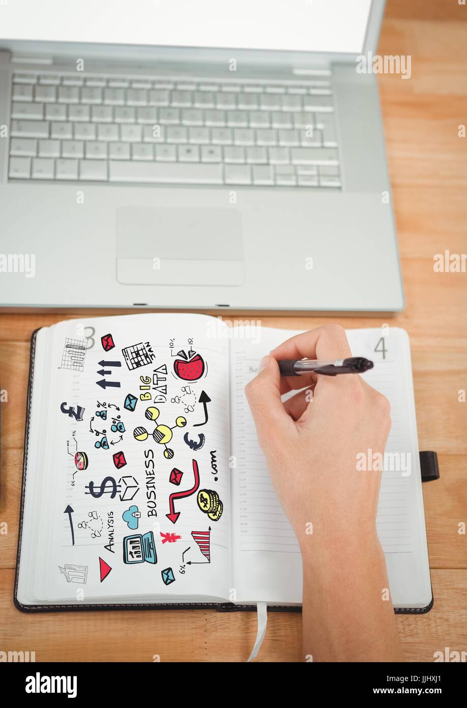 Business-Kritzeleien auf Notizblock mit Hand schreiben und laptop Stockfoto