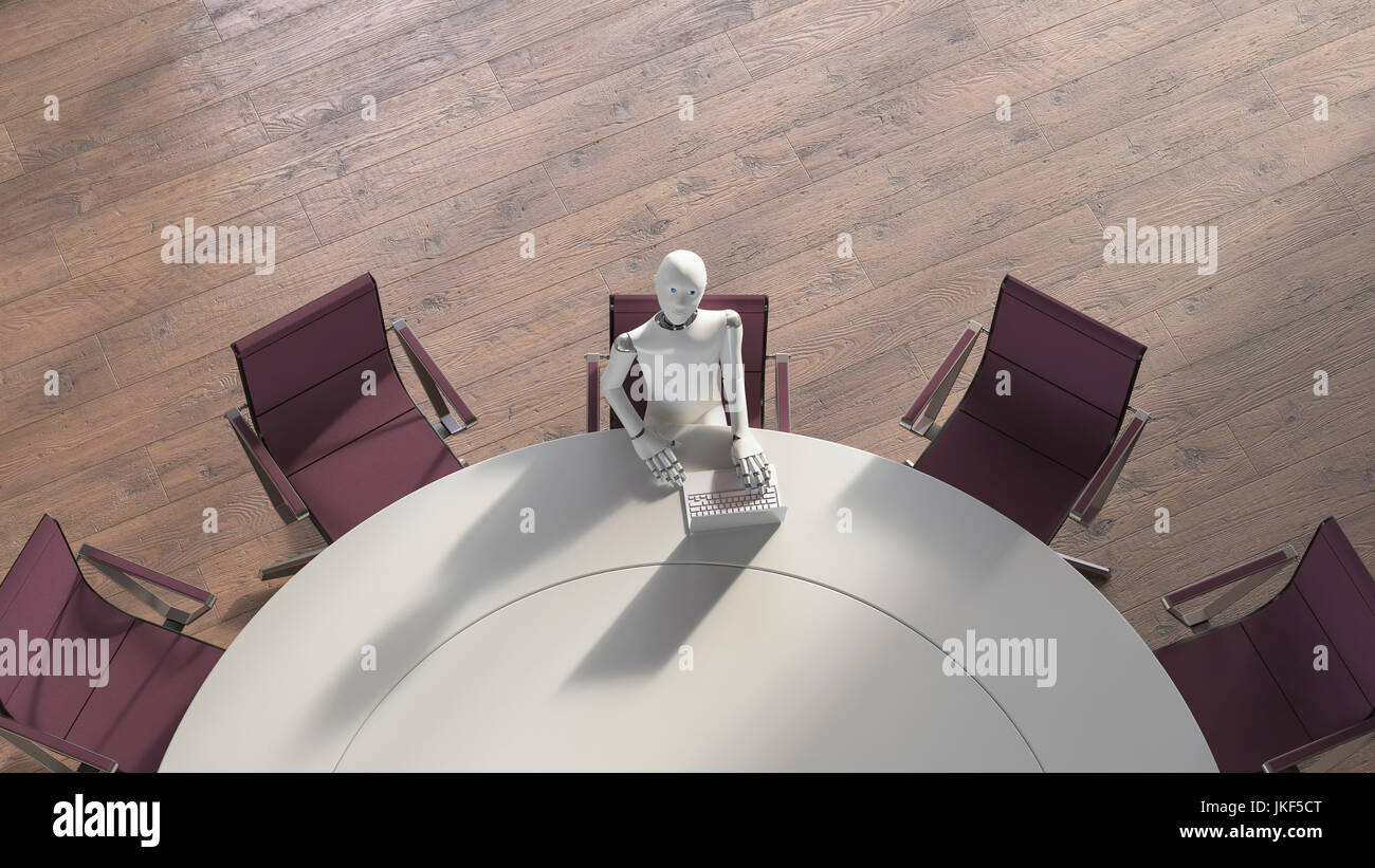 Roboter sitzen am Tisch, mit Laptop Stockfoto