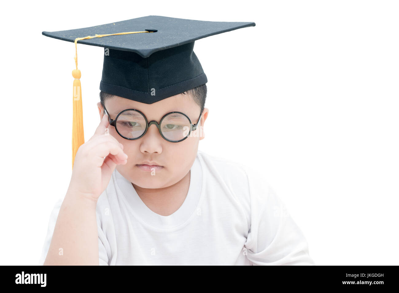 Asiatische Schule Kind graduate denken mit Graduation Cap isoliert auf weißem Hintergrund Stockfoto