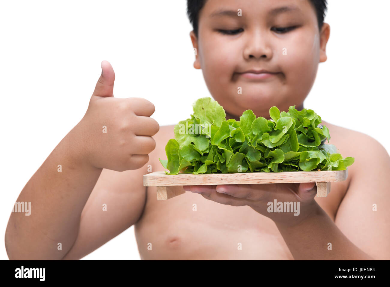 Salat-Roll auf dicke Hand isoliert auf weißem Hintergrund, Konzept-Diät und gesunde Ernährung Stockfoto