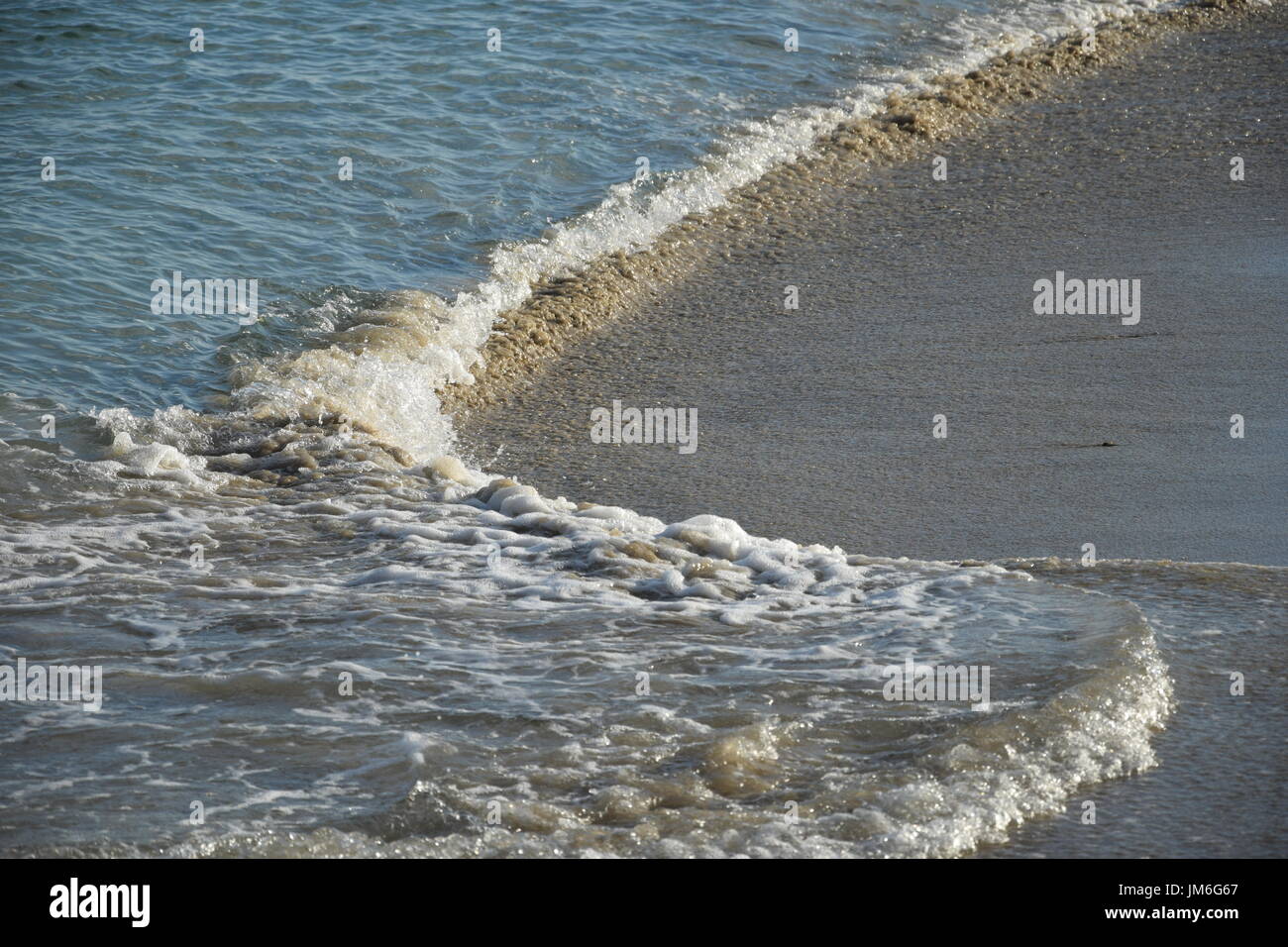 Nahaufnahme Foto von Strand Wellen kommen, Atlantik Stockfoto