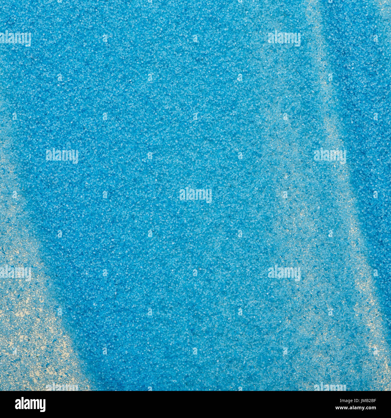 Makroaufnahme einer blauen Sand Textur. Partikel aus blauem Sand aus kurzer Distanz. Stockfoto