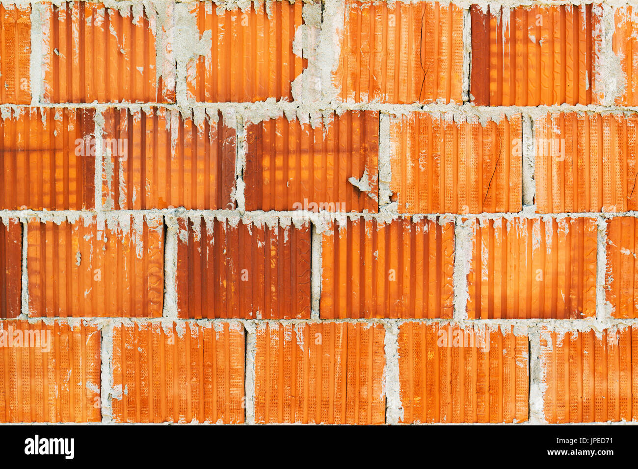 Clay blockiert Ziegel Wandfläche als Bau-Industrie-Hintergrund Stockfoto