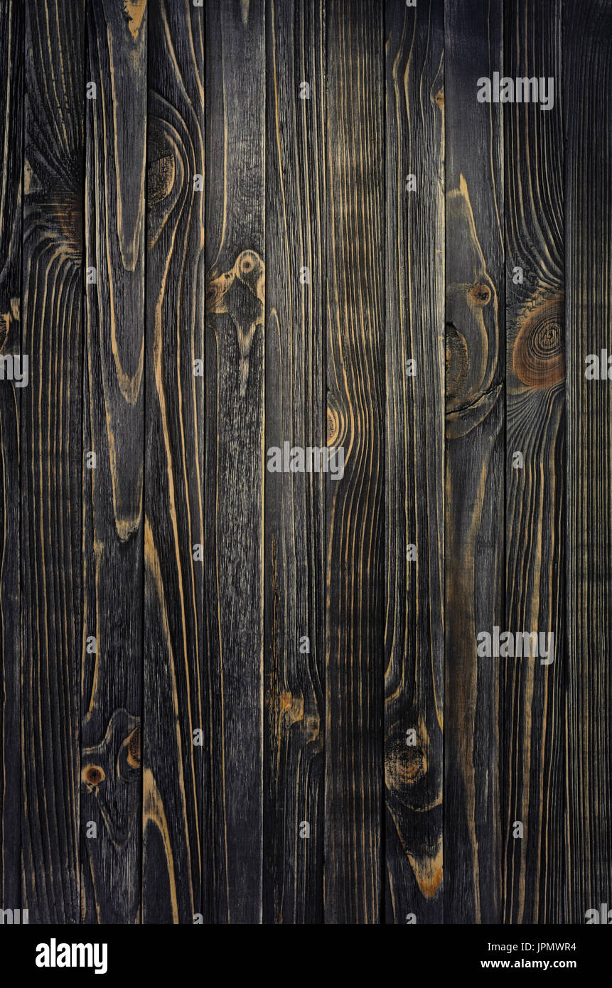 Dunklem Holz. Panel des vertikalen Alter Holztafeln mit Lichtfleck Stockfoto