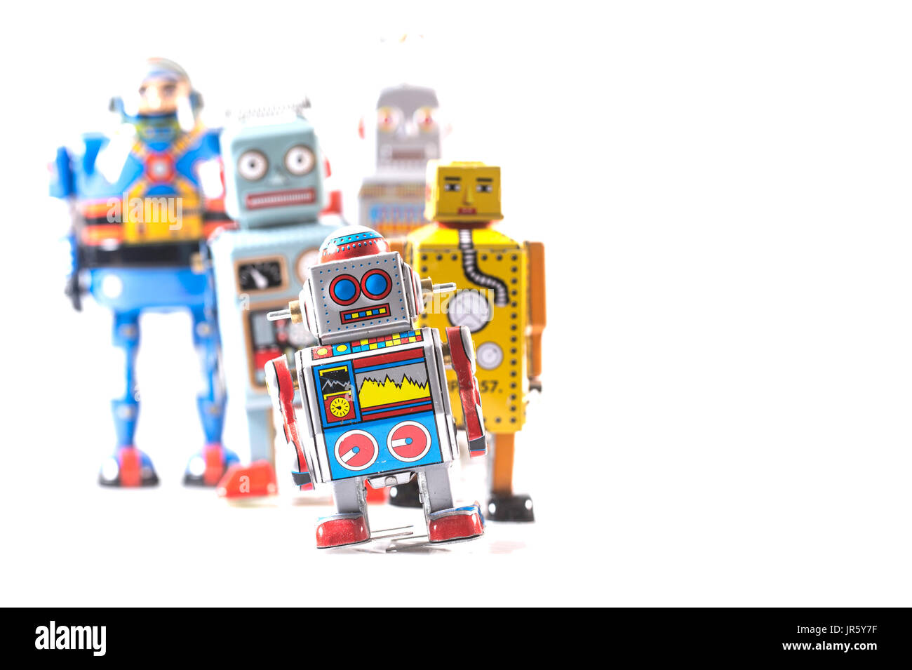 Gruppe von Retro-Zinn-Roboter auf einem weißen Hintergrund mit Textfreiraum Stockfoto