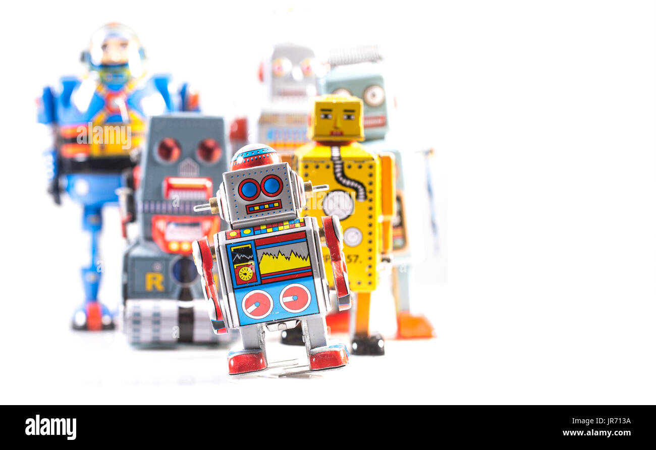 Gruppe von Retro-Zinn-Roboter auf einem weißen Hintergrund mit Textfreiraum Stockfoto