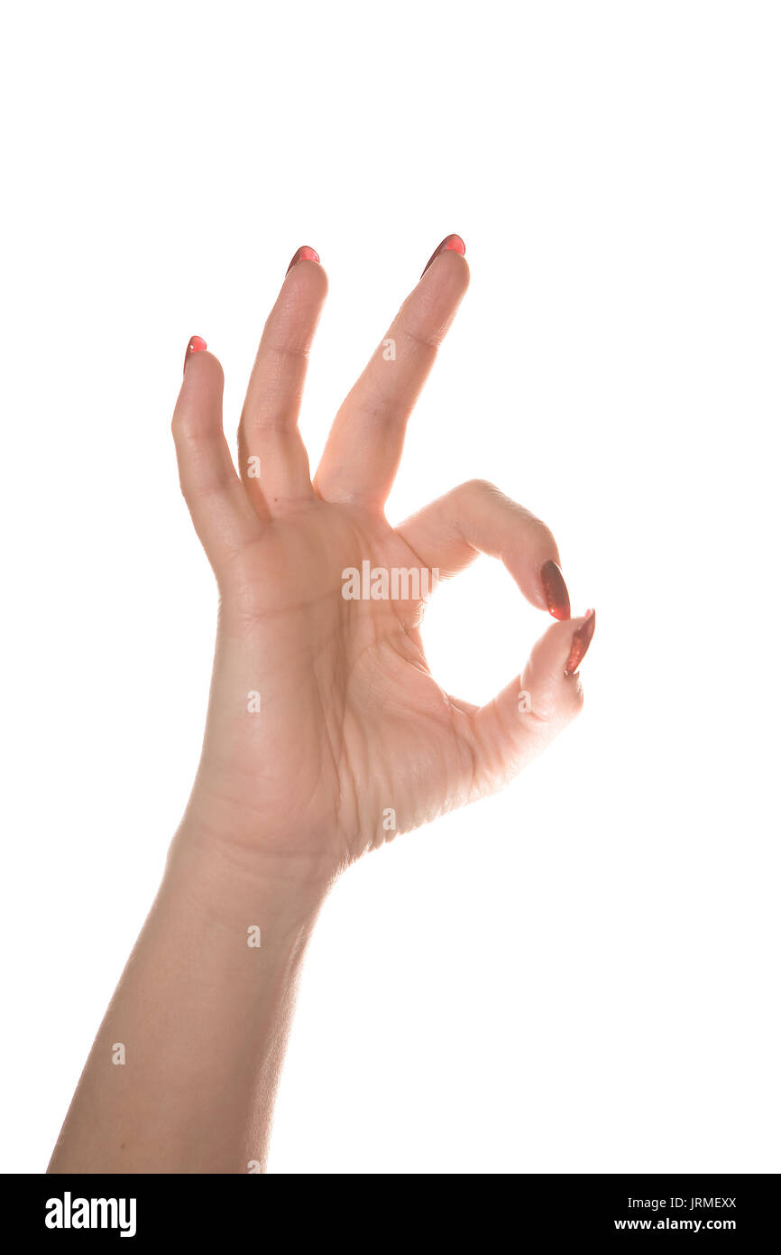 Geste "Okay." schöne und anmutige weibliche Hand auf einen weißen Hintergrund zeigt verschiedene Gesten. Stockfoto