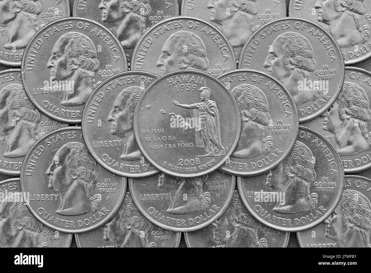 Hawaii State und Münzen der USA. Stapel der US quarter Münzen mit George Washington und auf der Oberseite ein Viertel der Hawaii State. Stockfoto