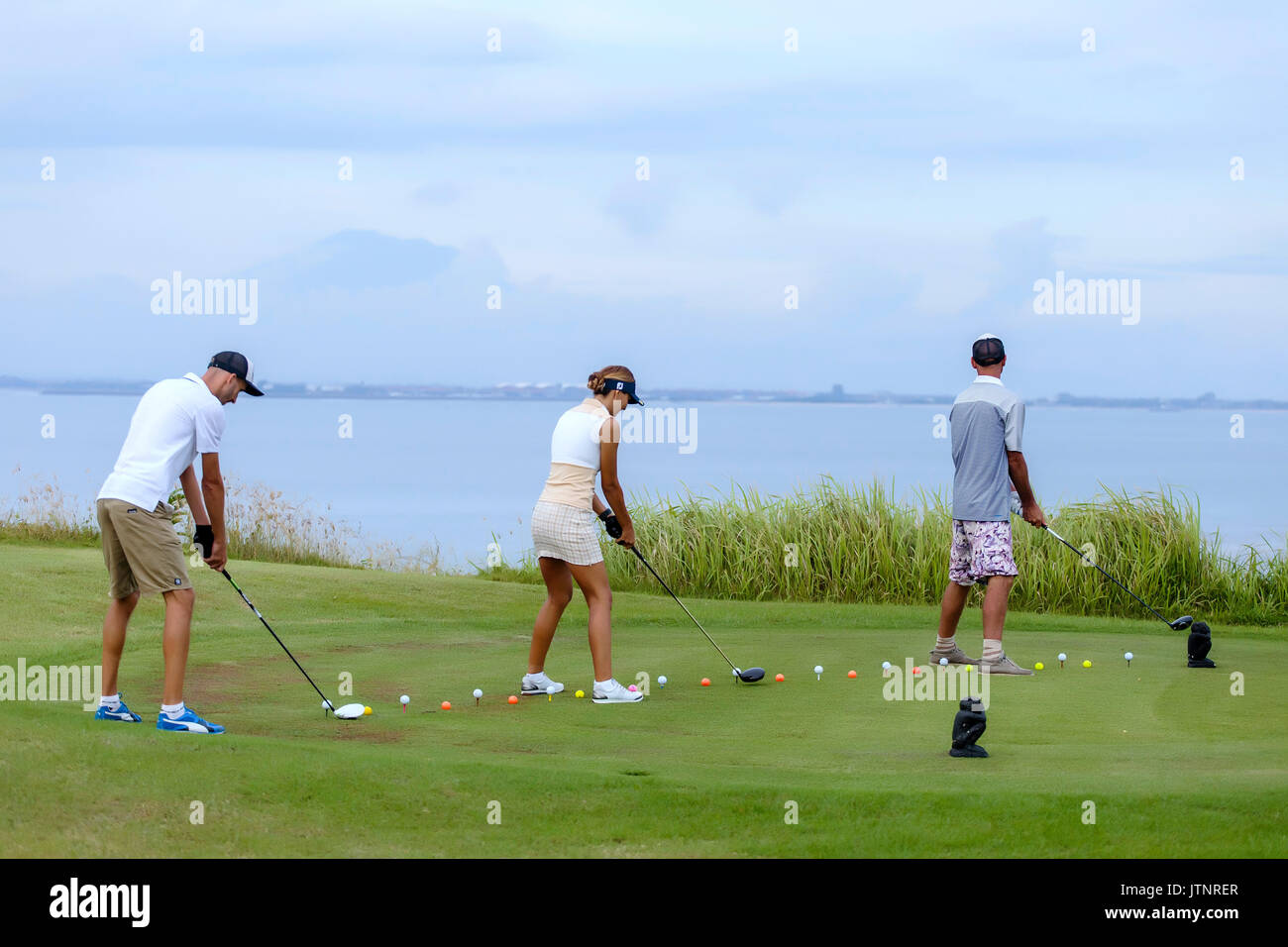 Golf Spieler und das Meer im Hintergrund, Bali, Indonesien Stockfoto