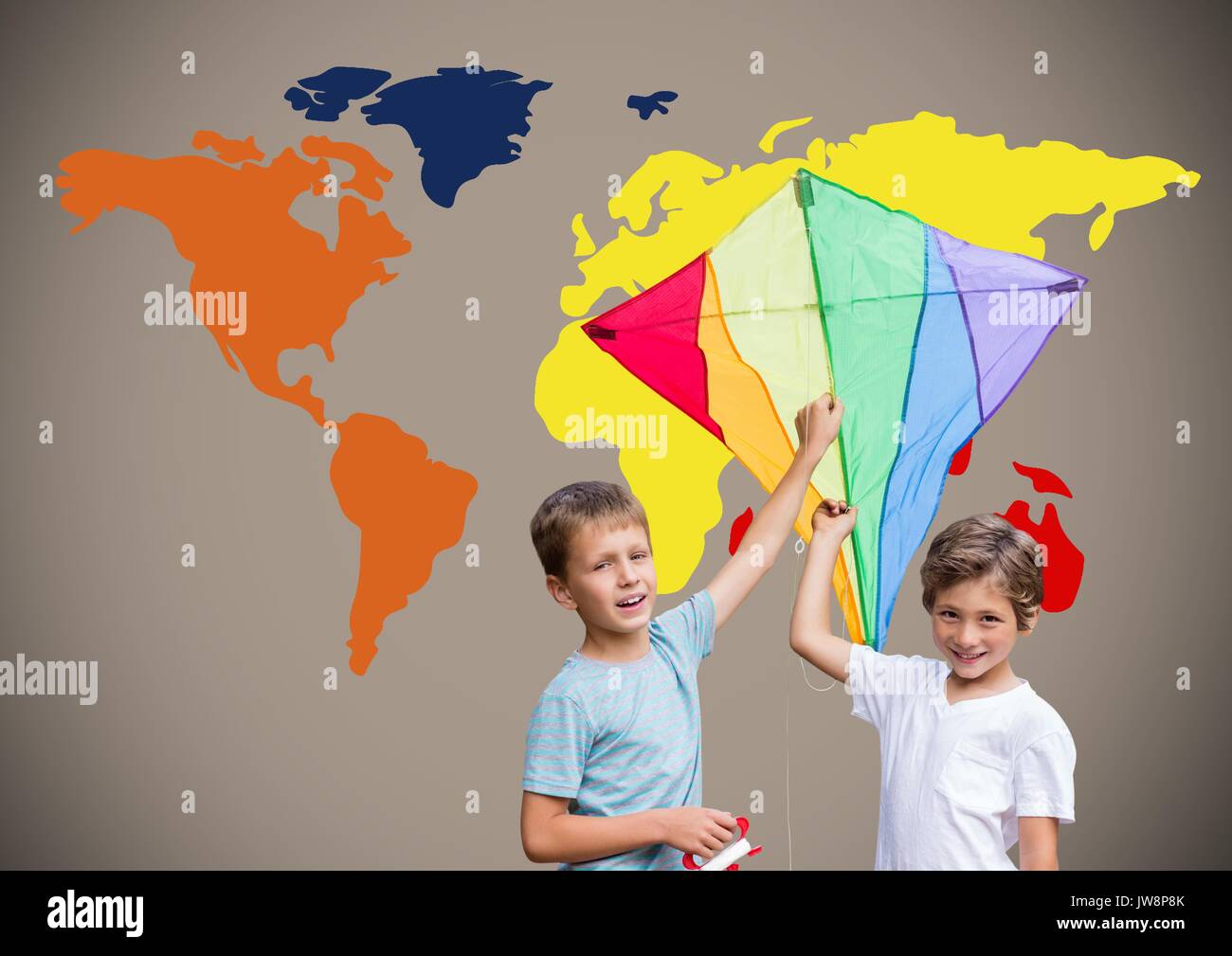 Digital composite Kinder holding Kite vor bunten Welt Karte Stockfoto
