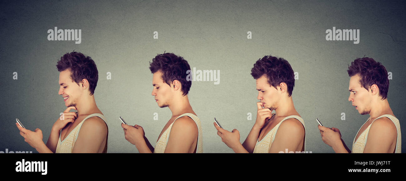 Junger Mann zum Ausdruck bringen verschiedene Emotionen mit seinem Handy auf grauem Hintergrund Stockfoto