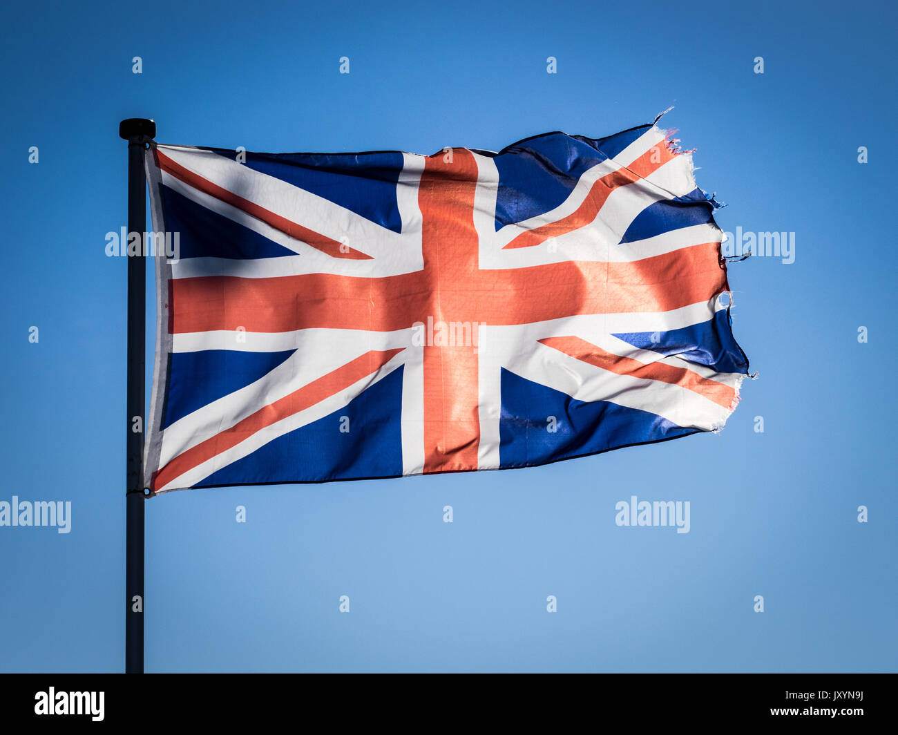 Union Jack Fahnen, Hinterleuchtung von Sunshine Stockfoto