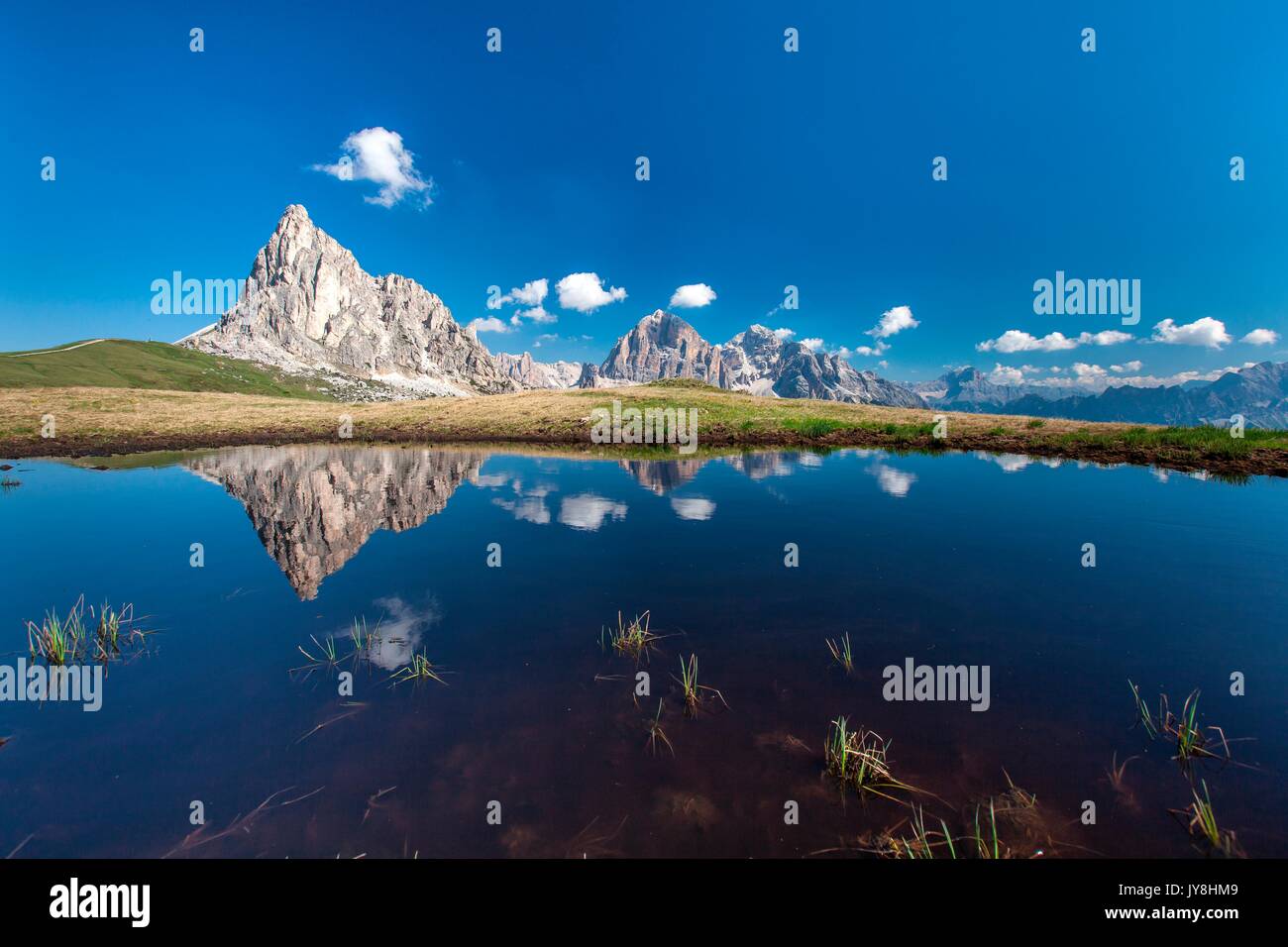 Gusela and Tofane reflected in a puddle. Giau Pass, Cortina d'Ampezzo, Veneto Italy Europe Stockfoto