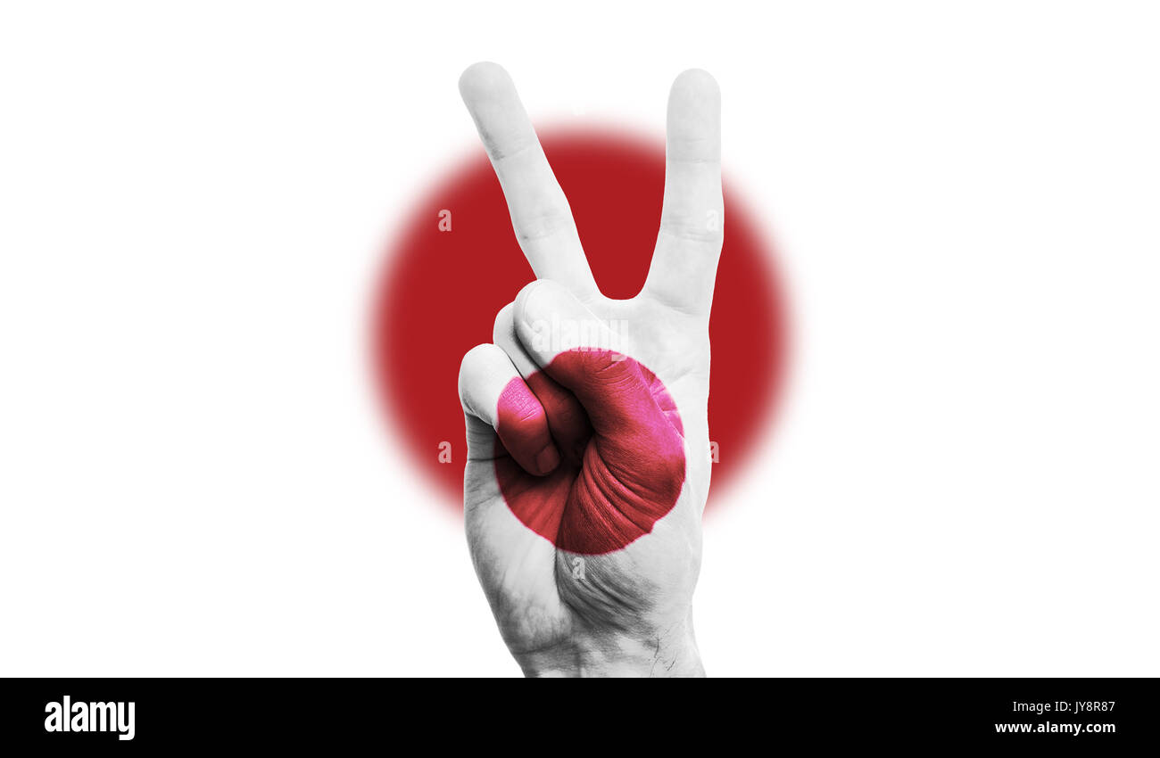Japan Nationalflagge auf eine männliche Hand mit einem Sieg, Frieden gemalt, stärke Zeichen Stockfoto