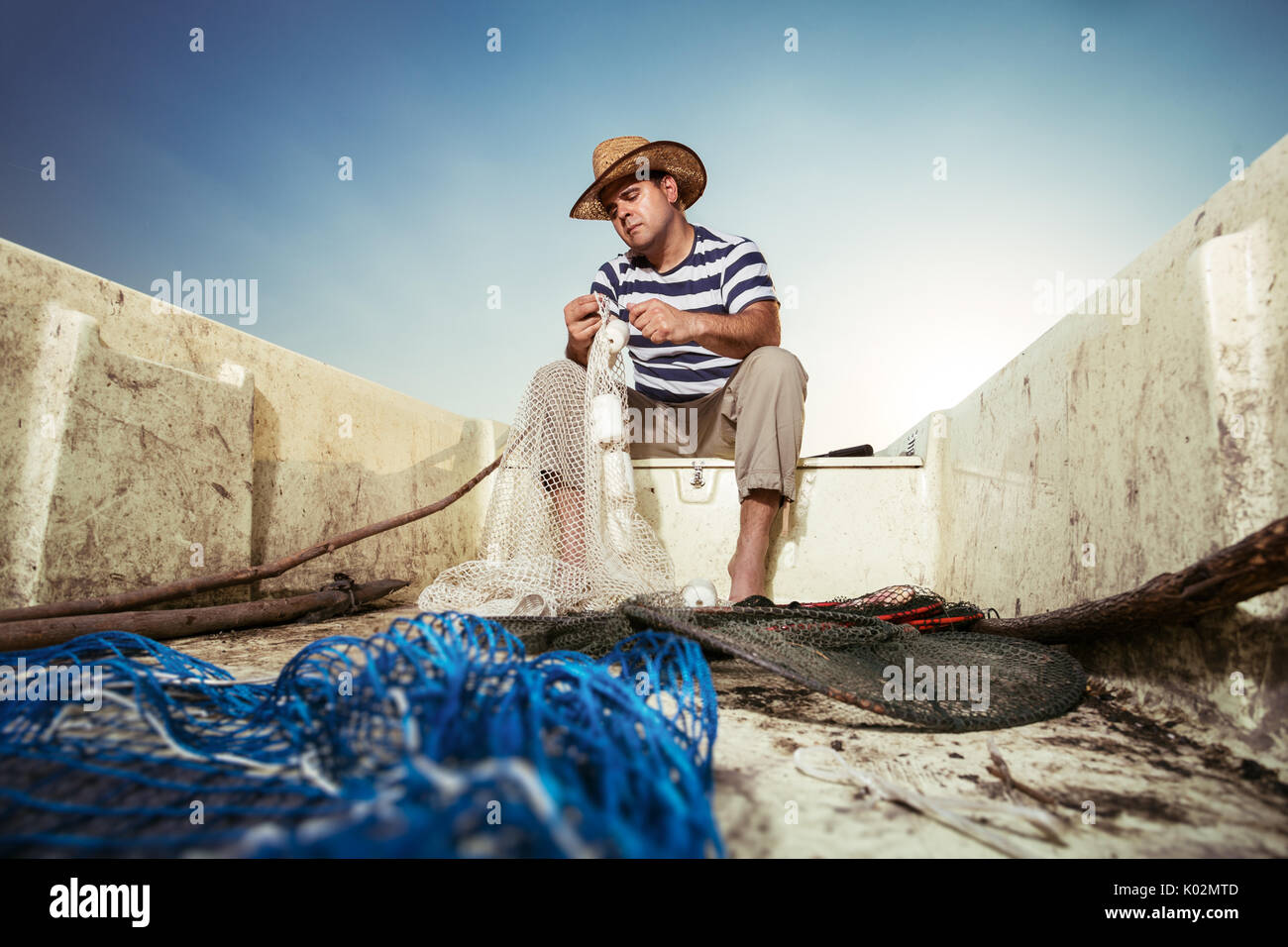 Fischer stricken einen Net Stockfoto