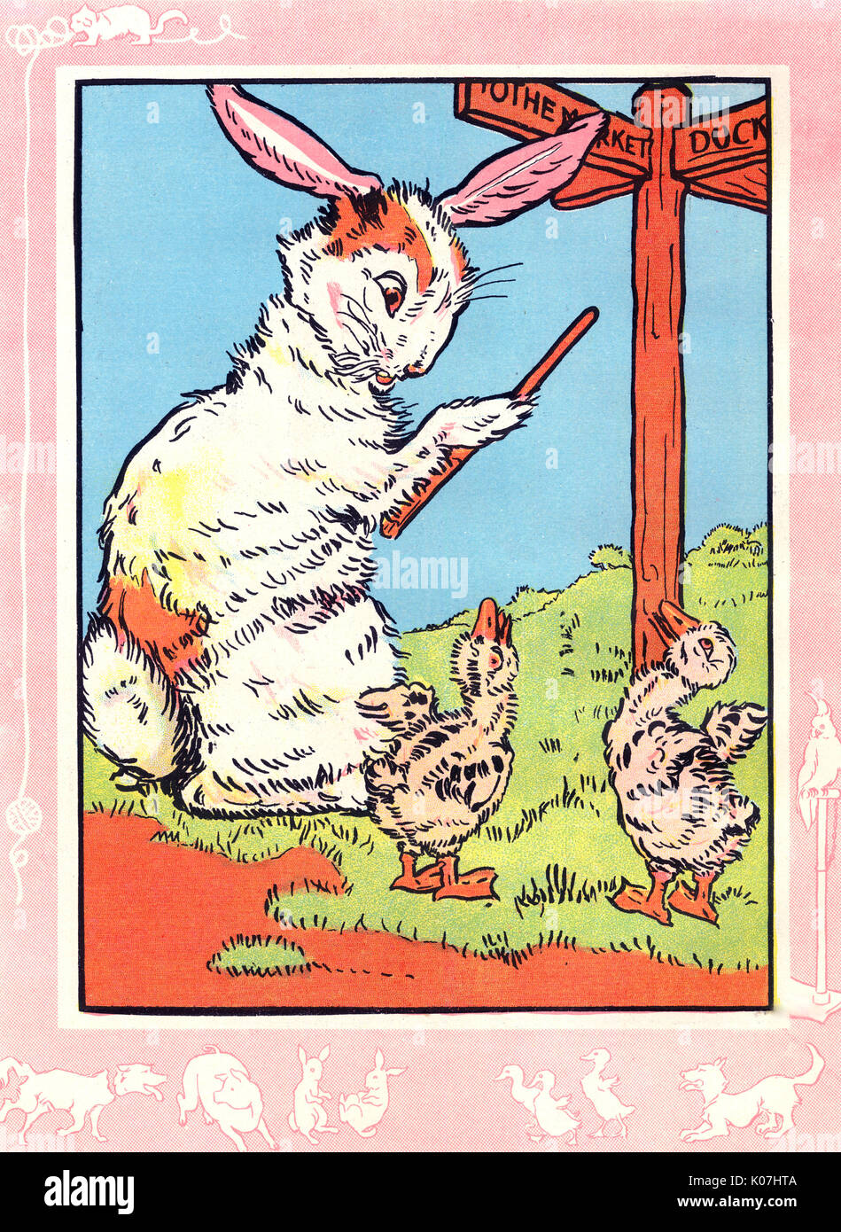 Mutter Bunny gibt den Weg zu zwei Gänseblümchen Stockfoto