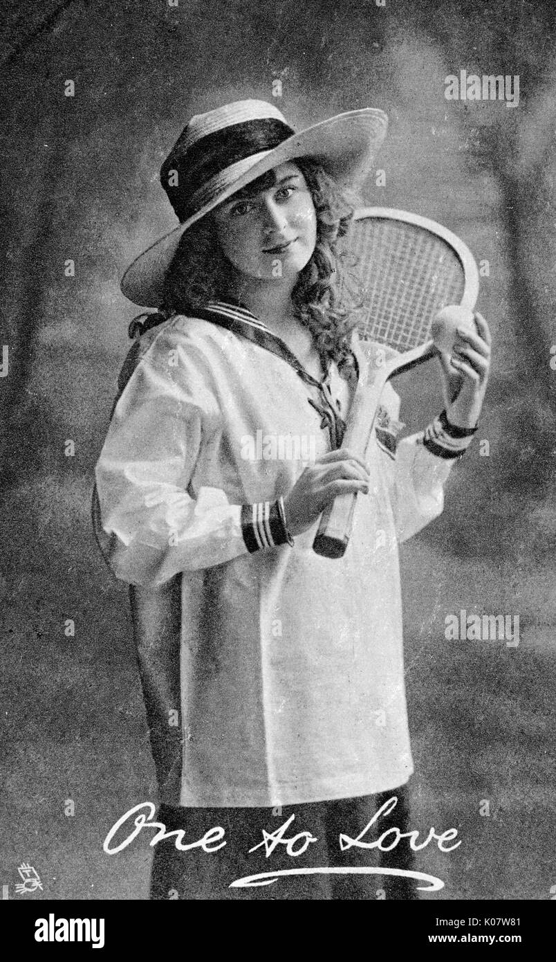 Junge Frau mit einem Tennisschläger Stockfoto
