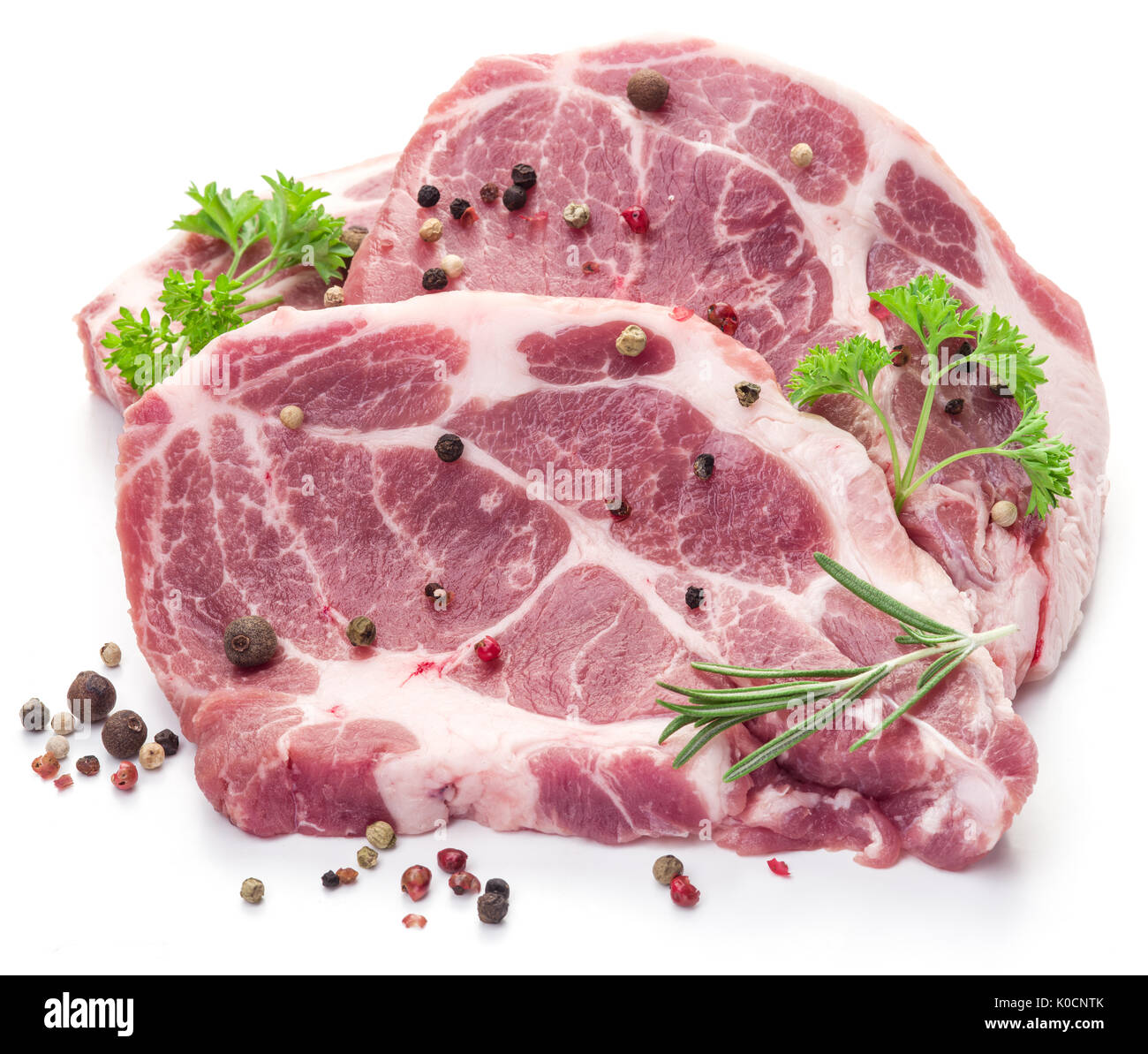 Rohes Schweinefleisch Fleisch Steaks mit Gewürzen auf dem weißen Hintergrund. Stockfoto