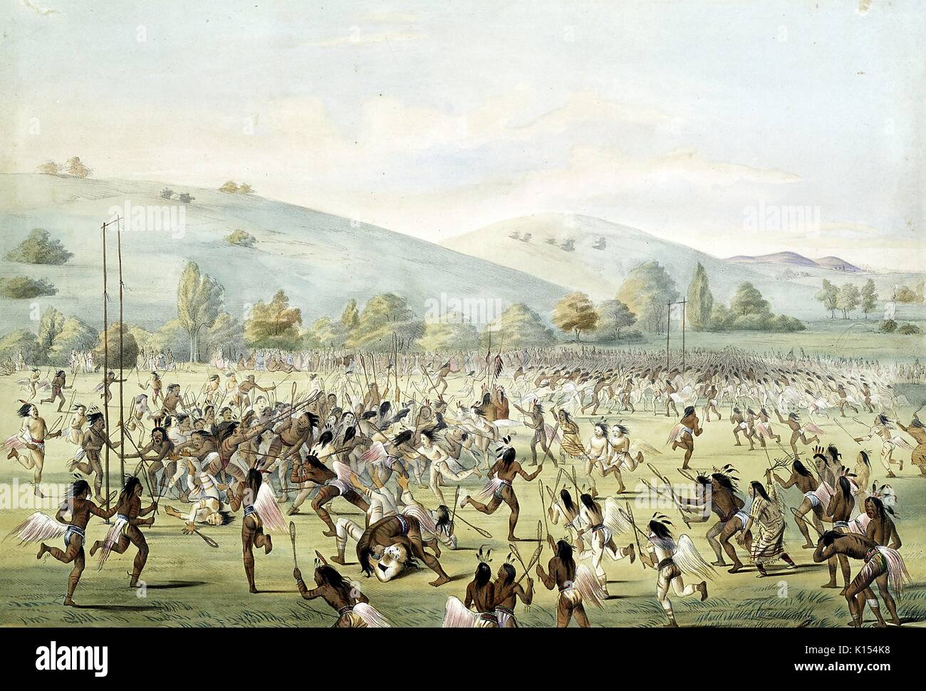 Native Americans in einer großen Gruppe spielen eine frühe Version des Spiels lacrosse, 1888. Von der New York Public Library. Stockfoto