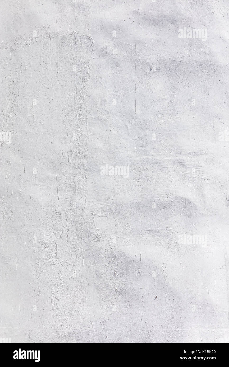 Holprige Pflaster wand Textur weiß lackiert als Hintergrund Stockfoto
