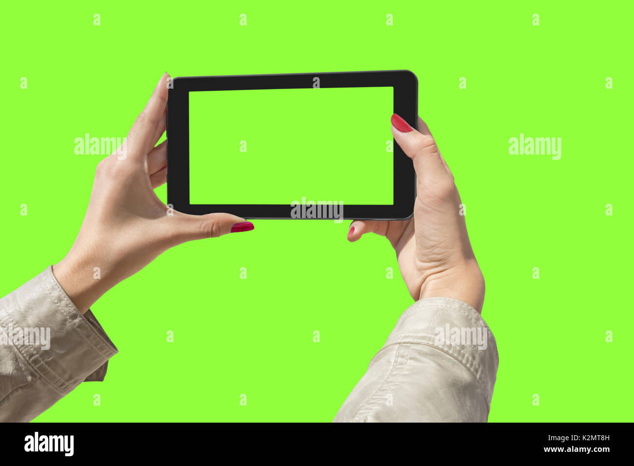 Junge Mädchen Hand mit einem Tablet auf Green Screen Stockfoto