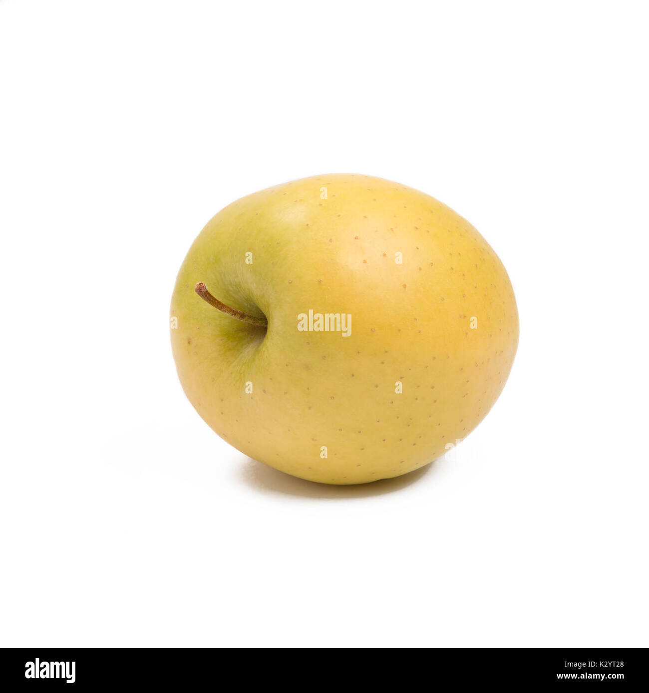 Reife, gelbe Apfel isoliert auf weiss Stockfoto