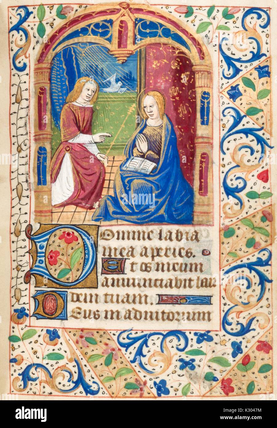 Bilderhandschrift Seite mit zwei Zahlen zu beten, von der "Initium sancti euangelii secundum iohannem, Gloria tibi Domine", aus dem 15. Jahrhundert Latein Buch der Stunden, 2013. Stockfoto