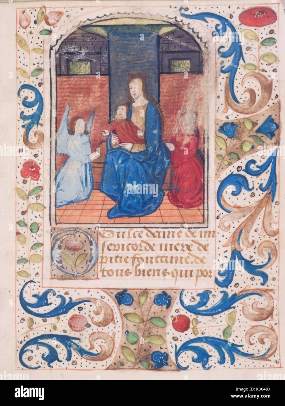 Bilderhandschrift Seite der Darstellung der seligen Jungfrau Holding Baby Jesus, von der "ténéré et credere mich faciat", aus dem 15. Jahrhundert Latein Buch der Stunden, 2013. Stockfoto