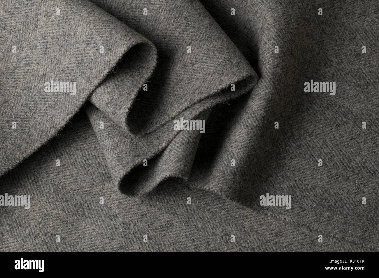 Grauer Wolle Stoff, Textil mit Mustern Hintergrund Stockfoto