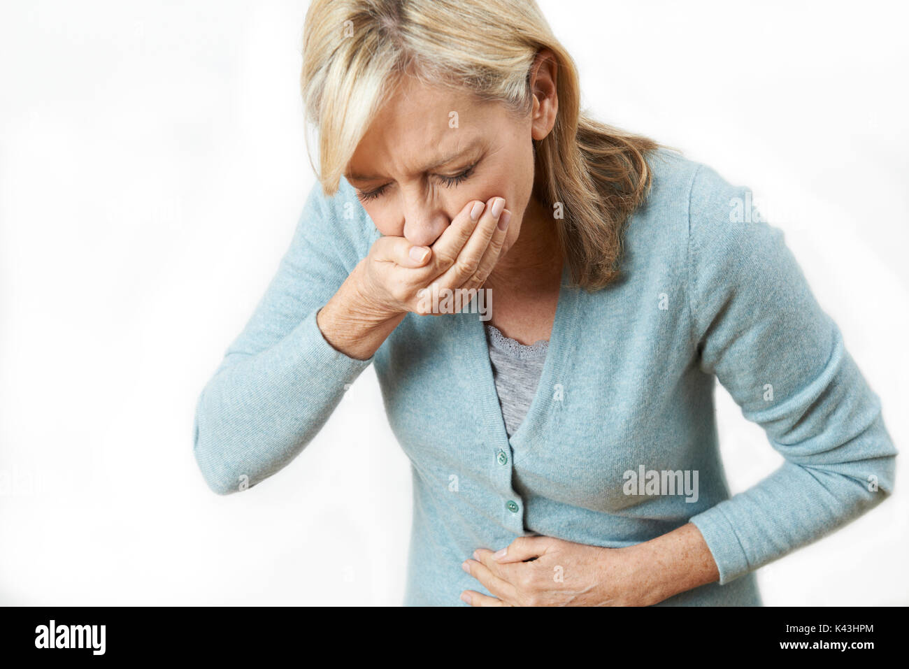 Studioaufnahme von Reife Frau leiden unter Übelkeit Stockfoto